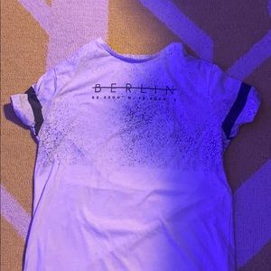 I’m selling a white kids t-shirt